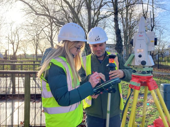 CAT staff operating survey equipment