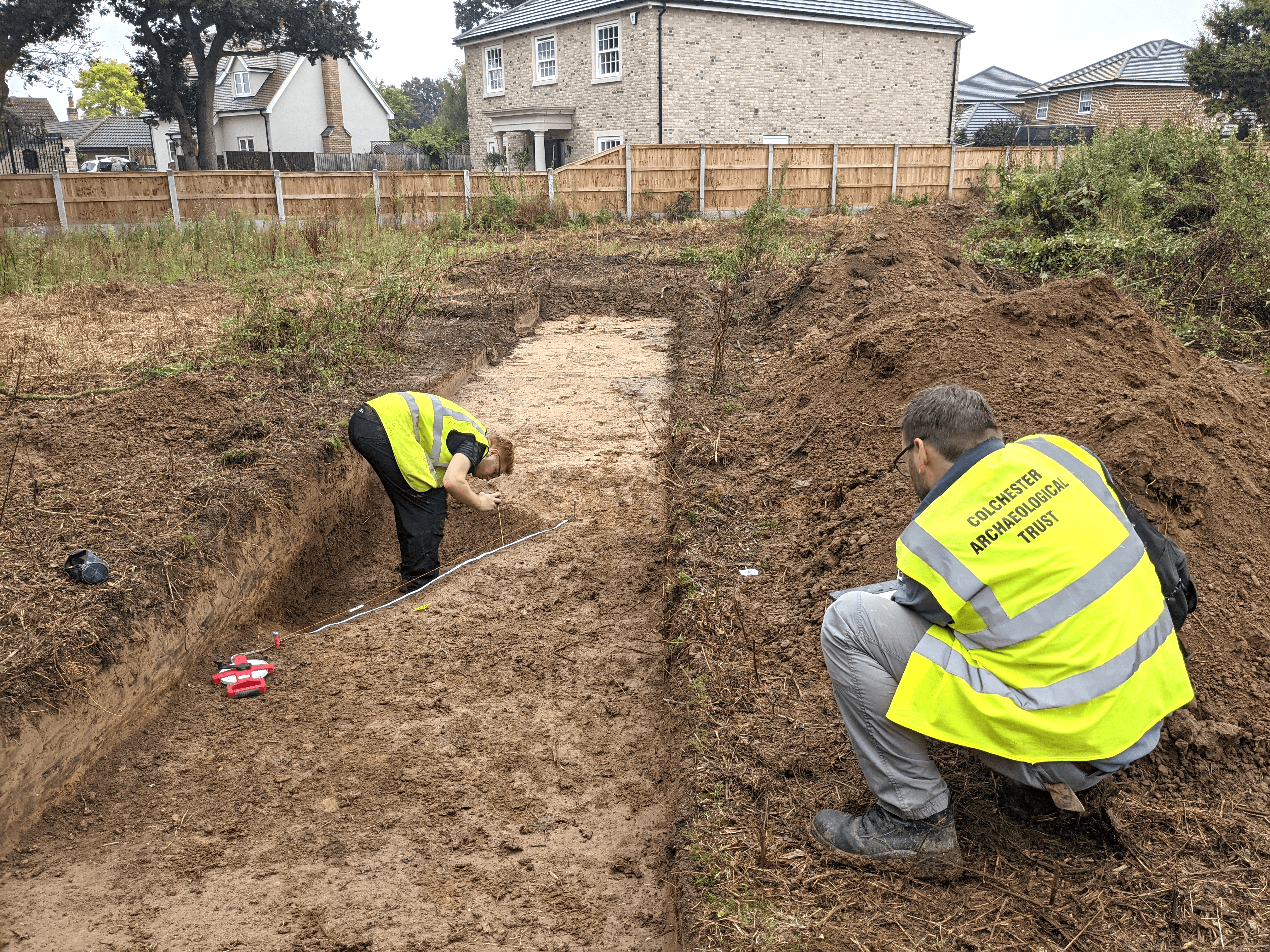 Working shot of CAT staff recording features within an evaluation trench in Elmstead Market. CAT report no.1708