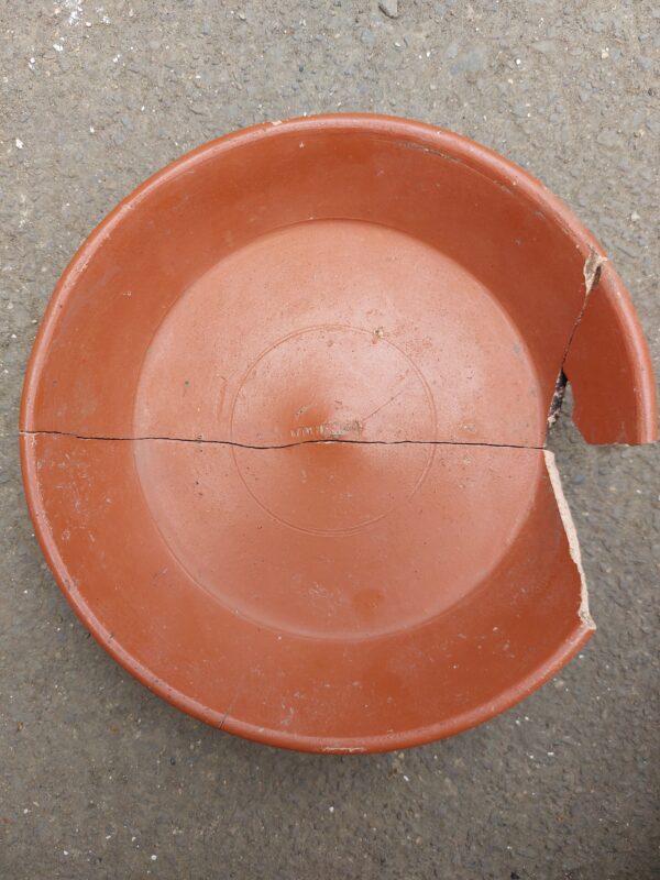 Top down view of samian dish with makers mark in the middle