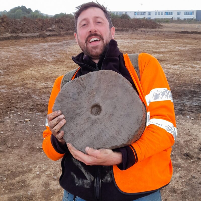 CAT Staff Harvey with a complete quern stone