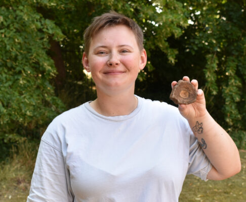 Person holding fossil